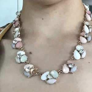 Gold chain necklace with multicolored bead pattern